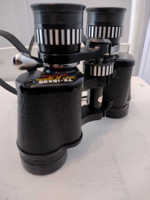 Японский бинокль Tasco 7-15х35 Zoom. Надійна техніка