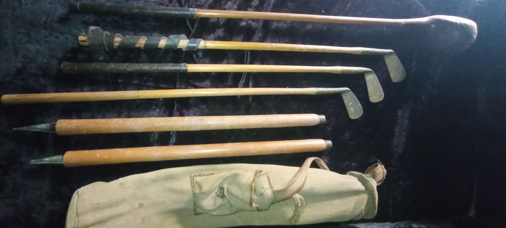 Tacos e saco golfe antigos