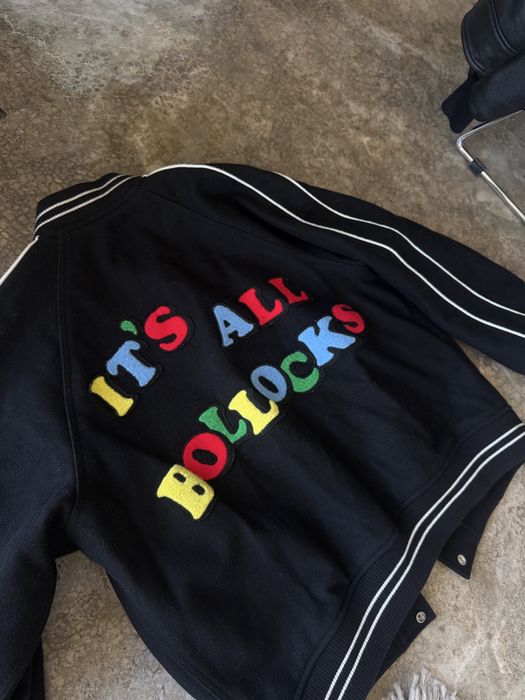 Supreme x Jamie Reid “It’s All Bollocks” Varsity Jacket — Black, SS21 — SKU SS21J65 BLACK.