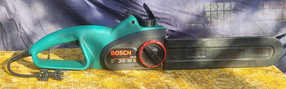 Электрическая цепная пила Bosch AKE 35-18 S German статуэт sharp.