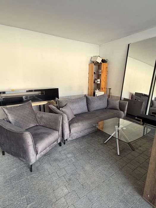 Szara rozkladana sofa + fotel