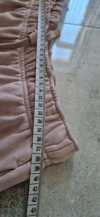 Nike Luźne spodnie dresowe pudrowy róż 38 40 M L