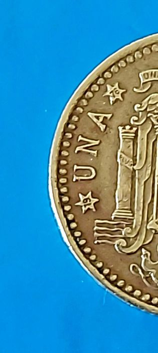 Una Peseta de 1975 com *76* na estrela