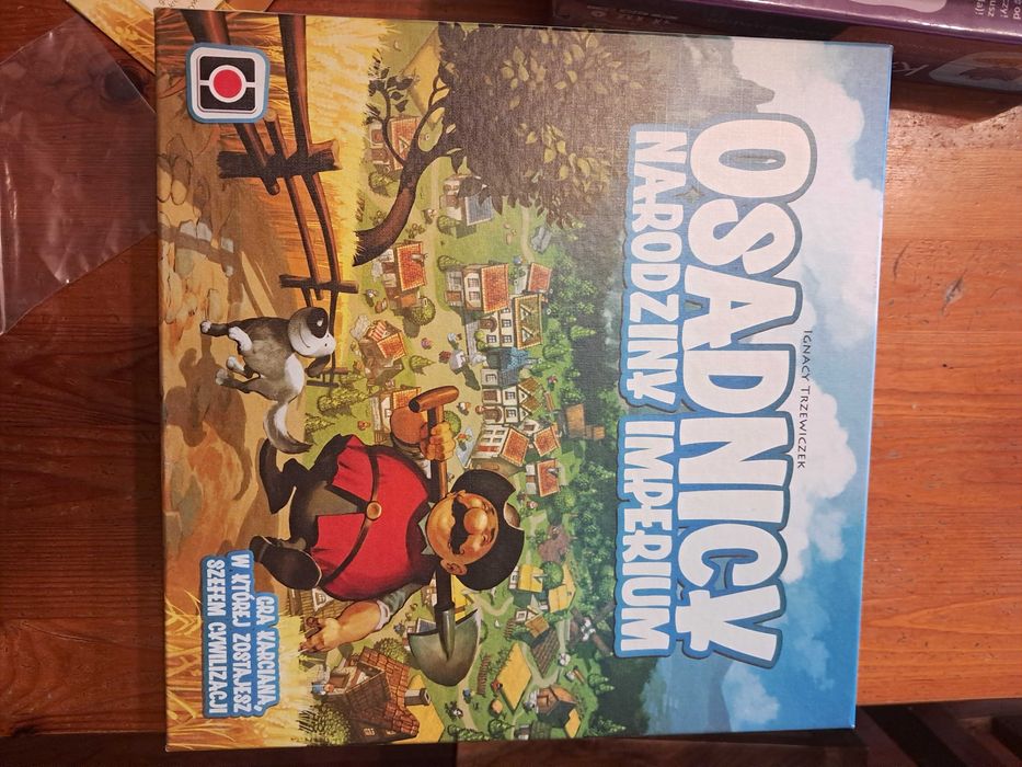 Osadnicy - narodziny imperium [Trzewiczek]. Bez folii. Żetony w wypraskach. Karty w folii.