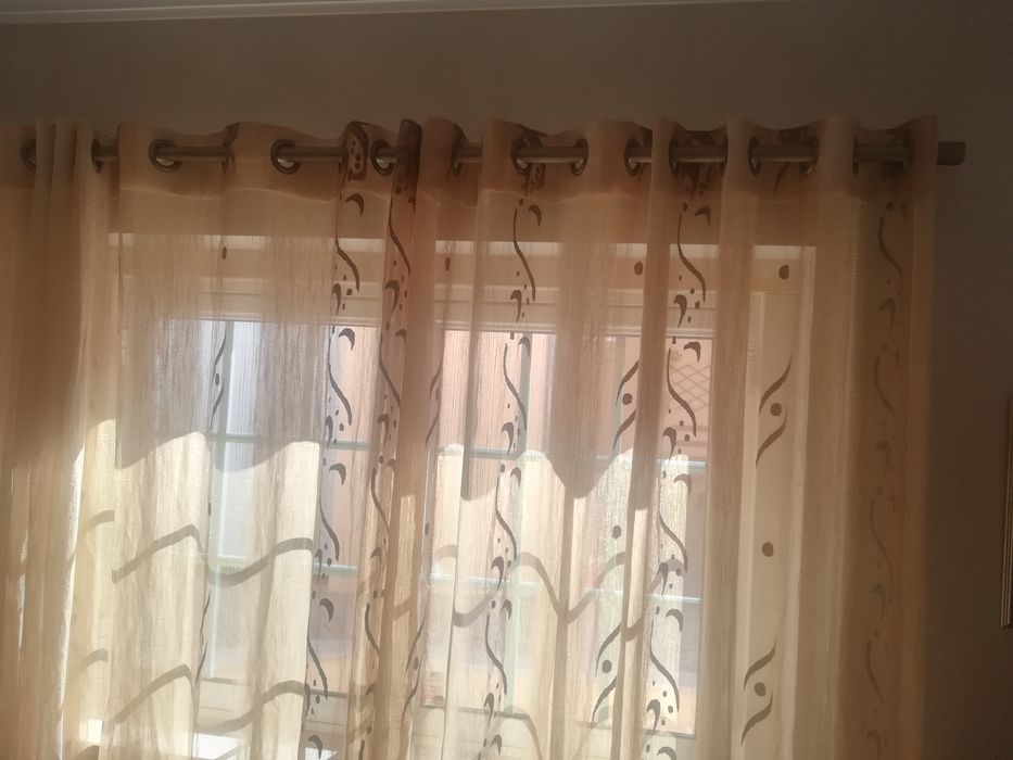 Conjunto de cortinados com argolas