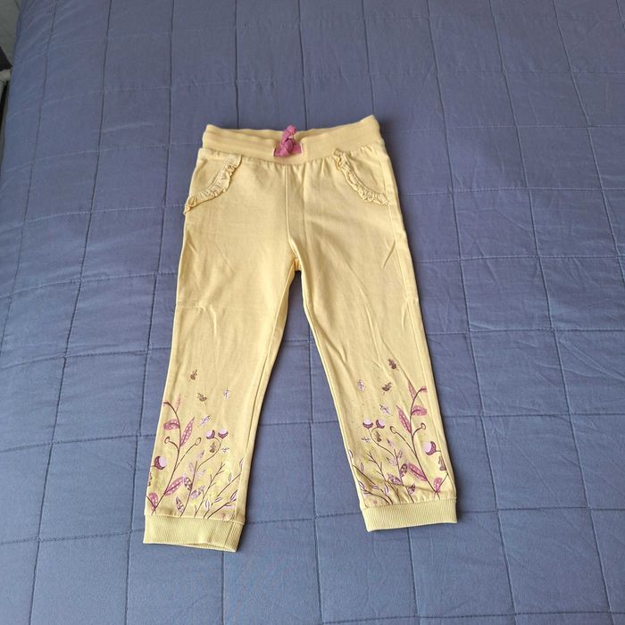 Spodnie dresowe 98 dla dziewczynki żółte w liście
