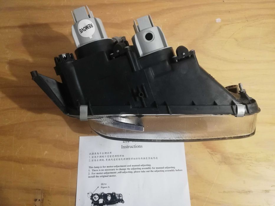 Farol esq Mazda 323f