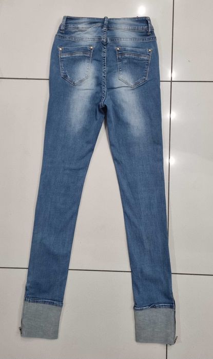 Spodnie damskie jeans z dziurami rozmiar XS