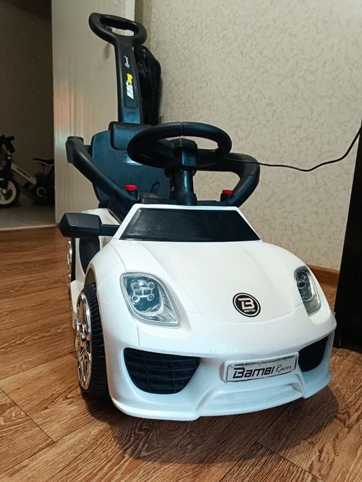 Електромобіль толокатор дитячий