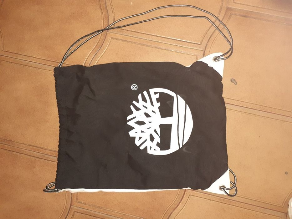 Saco capacete nexx e saco praia timberland