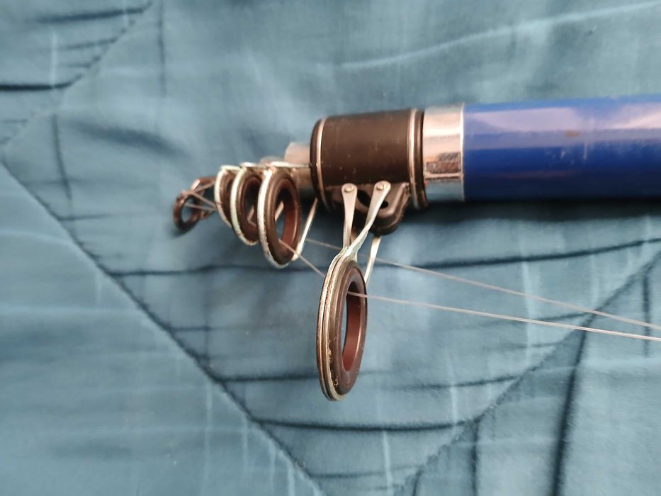 Cana de pesca + carreto + acessórios+ saco