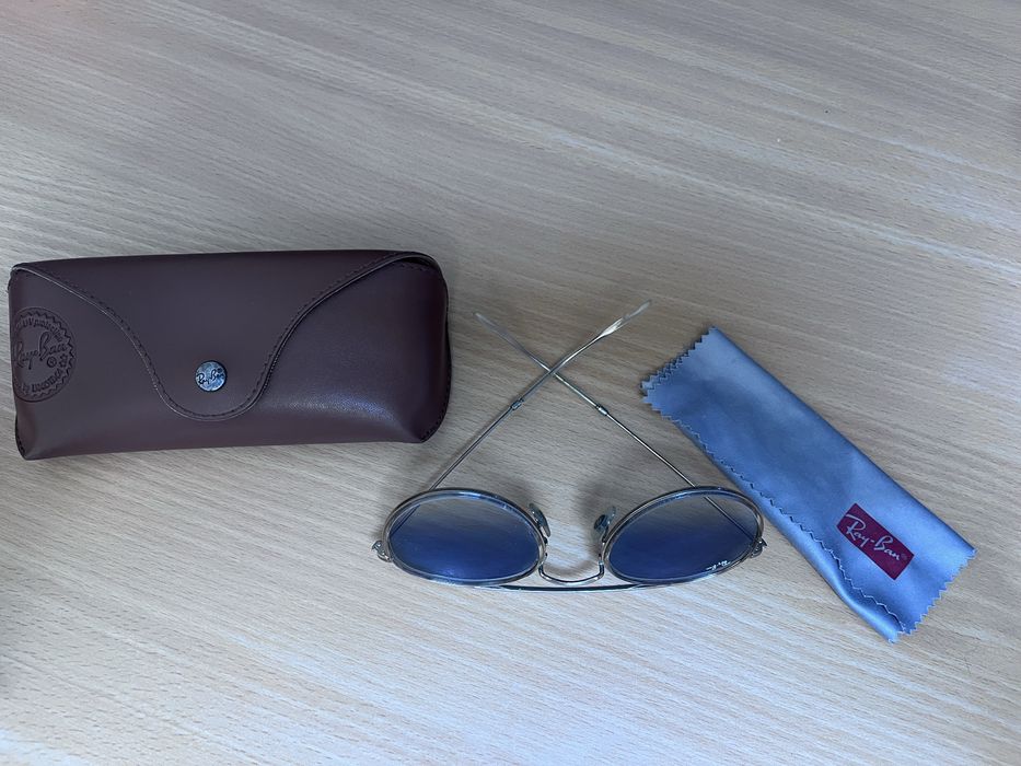 Óculos de Sol, usados sem riscos nas lentes.