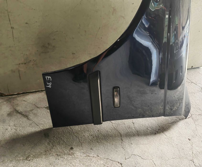 Guarda lamas esquerdo Bmw E39