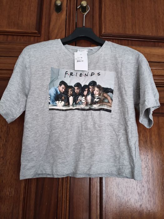New Friends crop-top-style T-shirt with label, size M