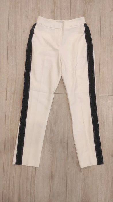 Białe spodnie w kant z lampasem, Reserved, r. 34/XS