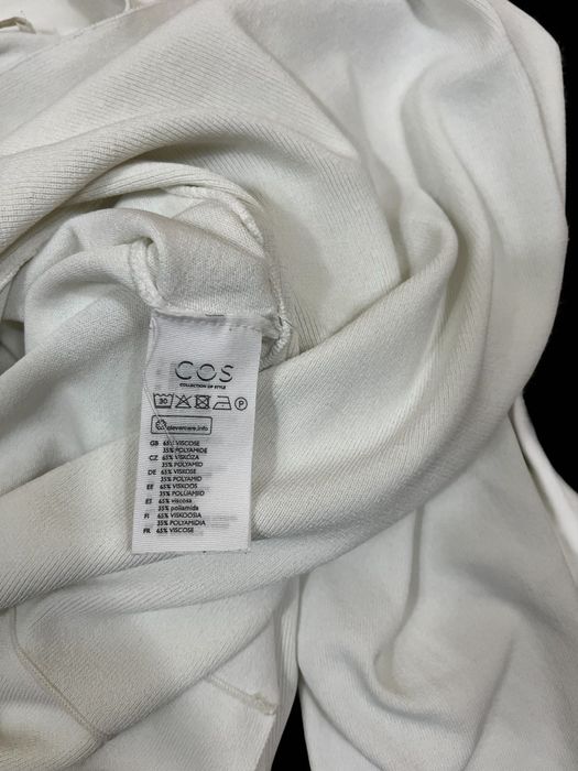 COS roz. XS damska bluzka z baskinką