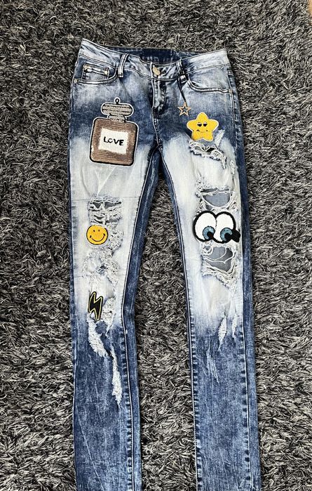 Spodnie jeansowe z dziurami