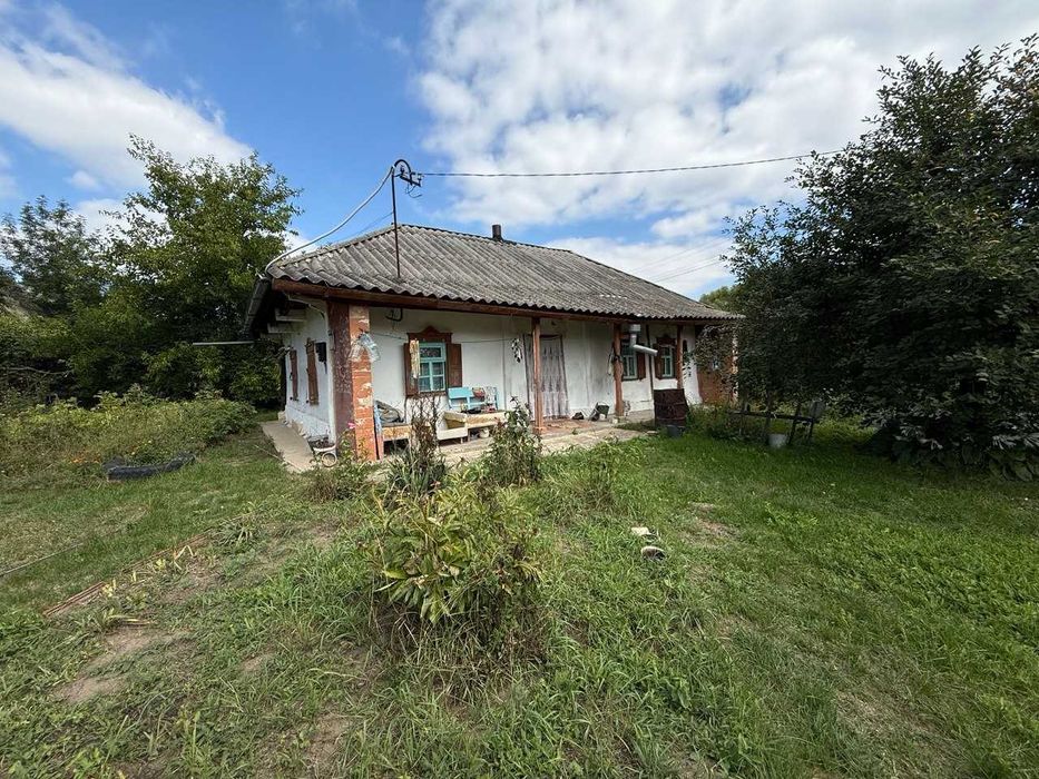 Одноповерховий будинок. 20км до центру міста. Ділянка 21 сотка. Жилий стан.