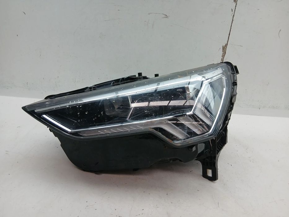 Ótica / farol esquerda AUDI Q3 (F3B)