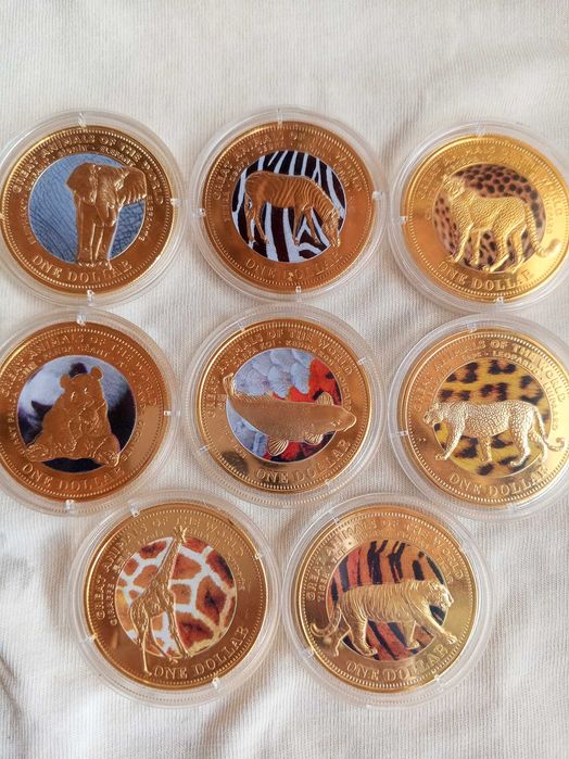 Продаю 8 позолоченных монет 1 доллар животные