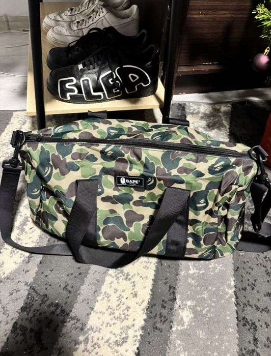 A Bathing Ape (BAPE) green camo duffle bag