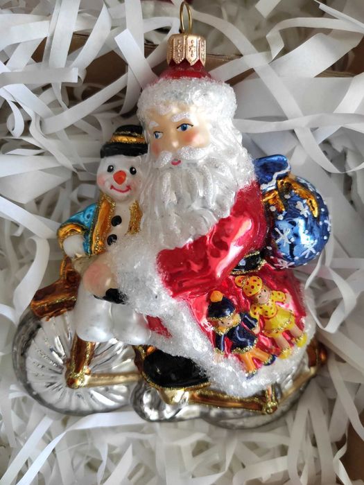 Szklana bombka Huras Family Mikołaj z bałwanem na rowerze