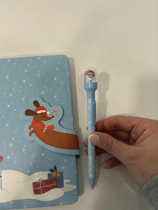 Caderno e caneta da Tiger