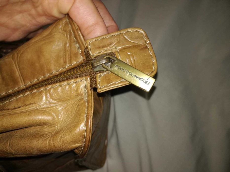 Mala castanha em pele