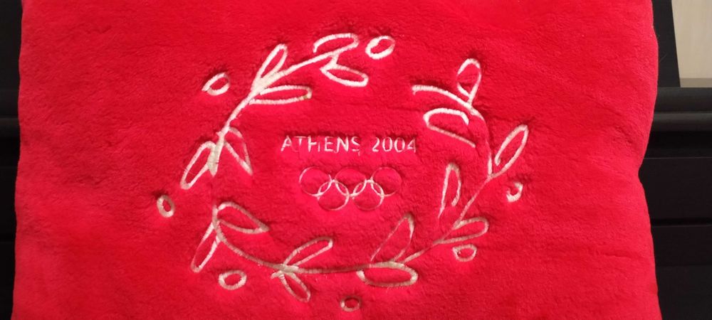 Almofada souvenir dos Jogos Olímpicos de Atenas 2004