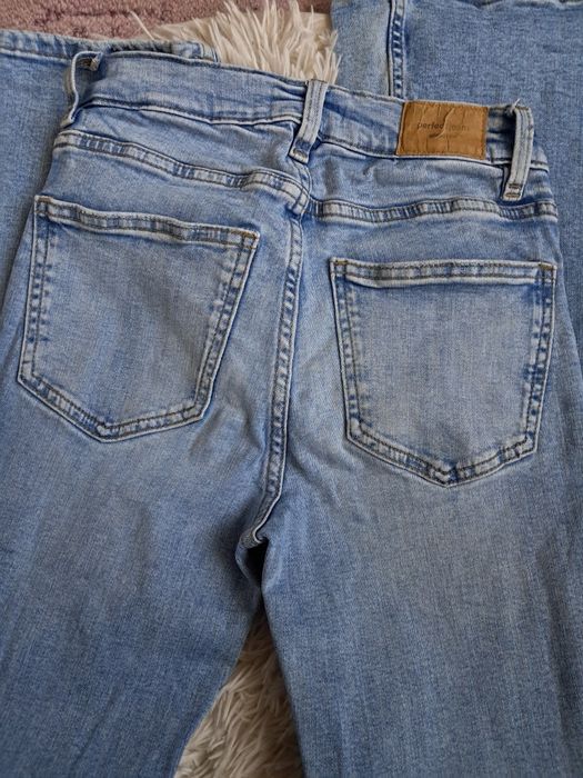 Dzwony jasnoniebieskie jeansowe Ginatricot XS wysoki stan