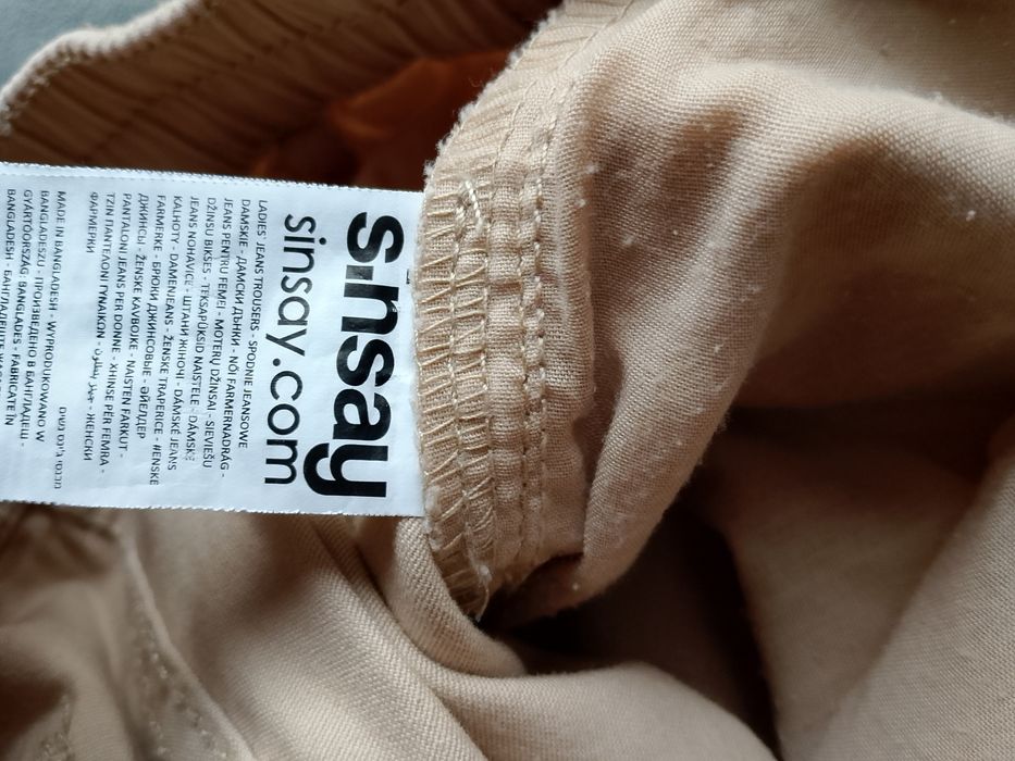 Spodnie z kieszeniami Sinsay beżowe 34