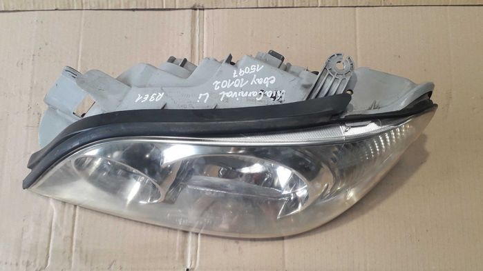 Farol esquerdo KIA CARNIVAL