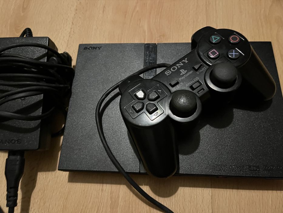 PS2 with controllers, games, and microphone for SingStar Latino64172206791810122