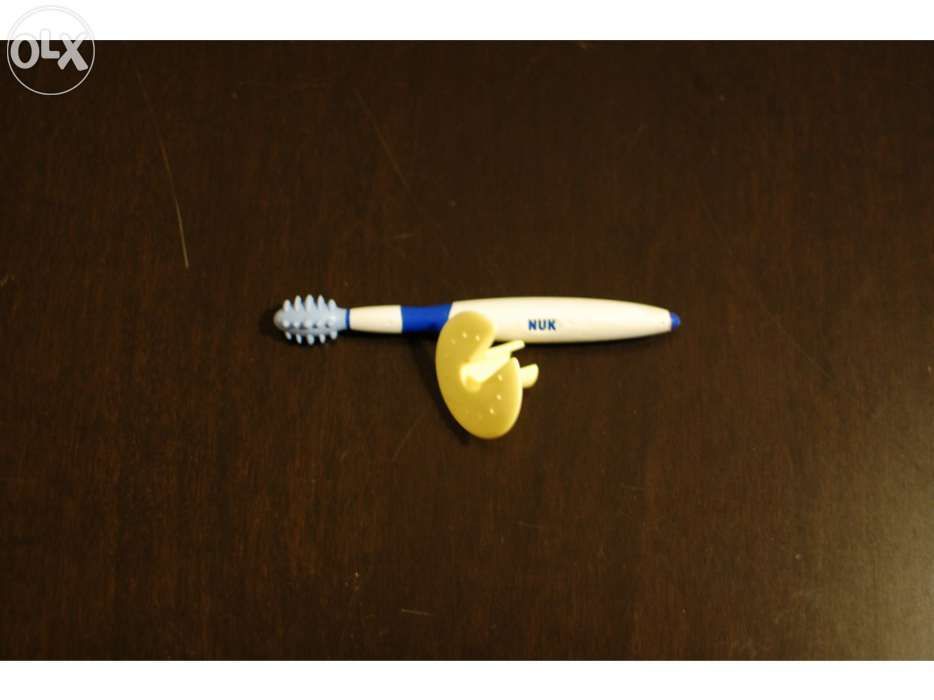 NUK Teether/Training Toothbrush with Protective Ring434463873927761920