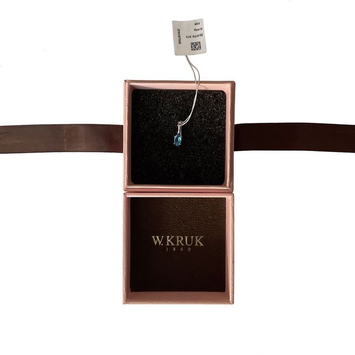 Subtelny wisiorek z białego złota i topazu_W.KRUK