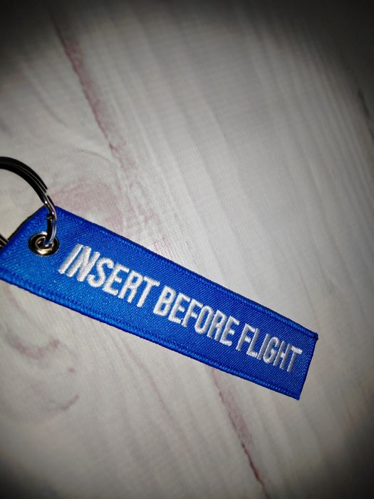 Niebieski haft Insert before flight
