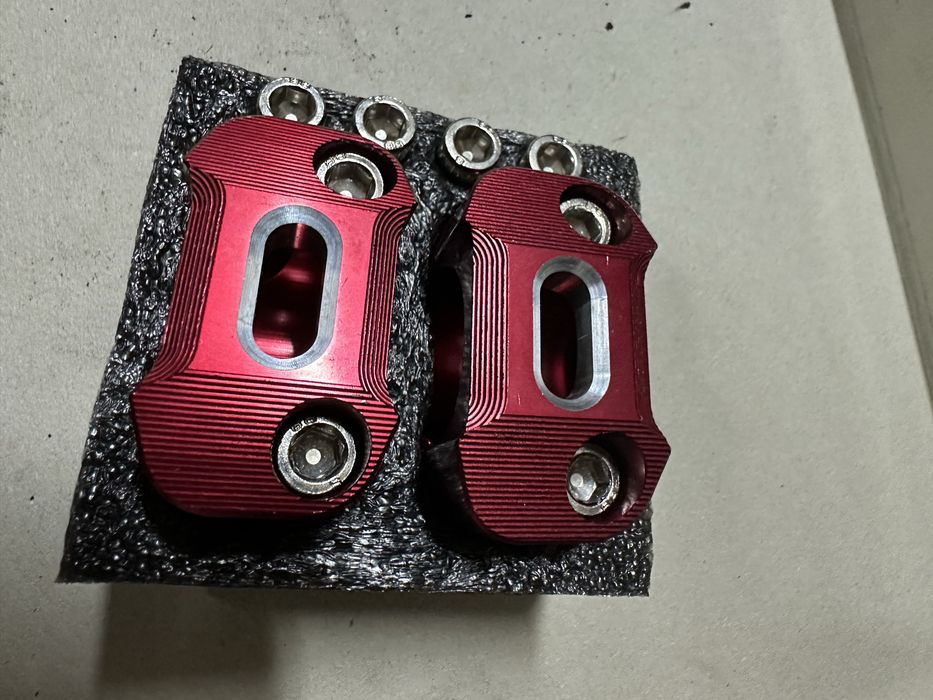 Abracadeiras (risers) para  guiadores de moto