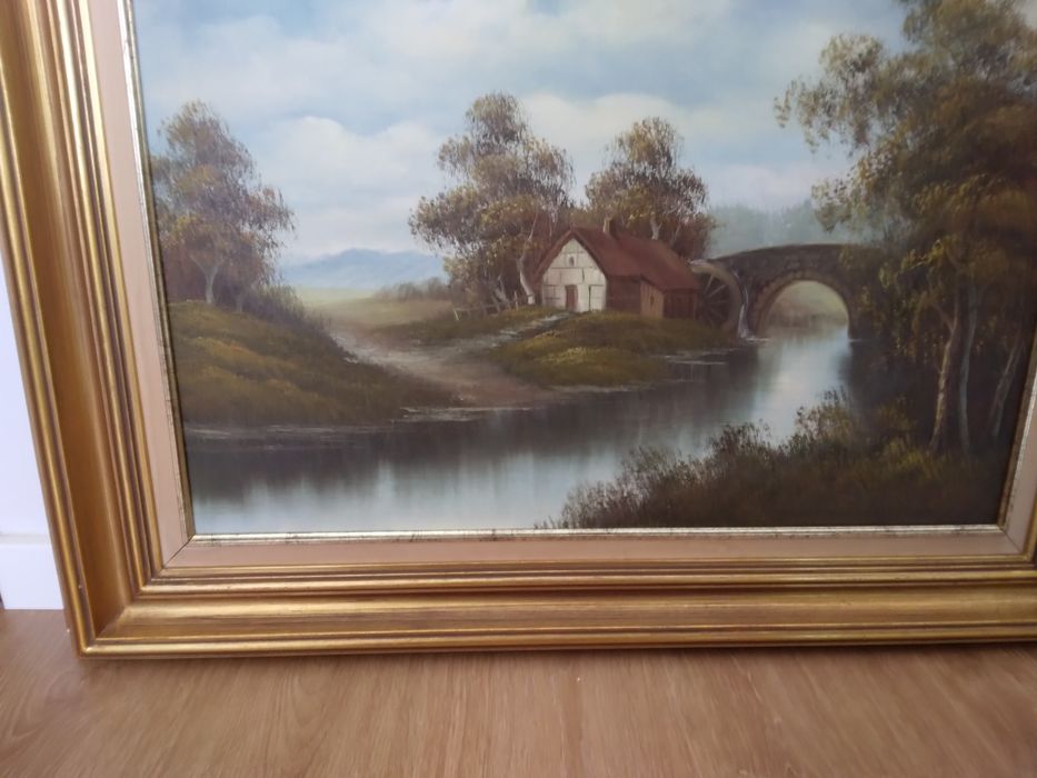 Quadro casa no lago com moldura banhada a ouro