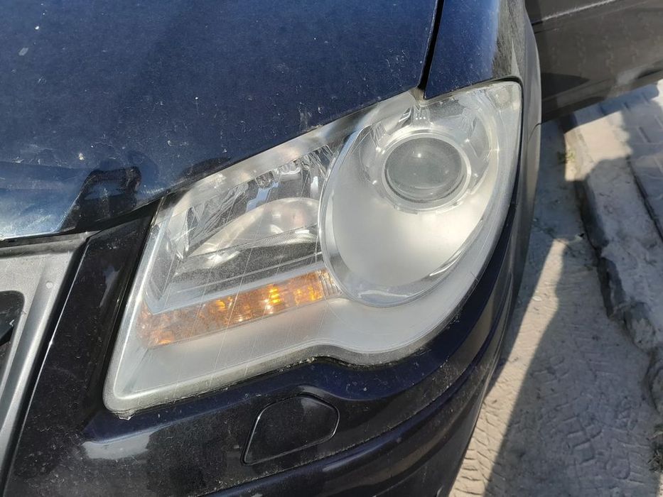 lampa przednia lewa xenon vw touran i lift 06-10r. al europa