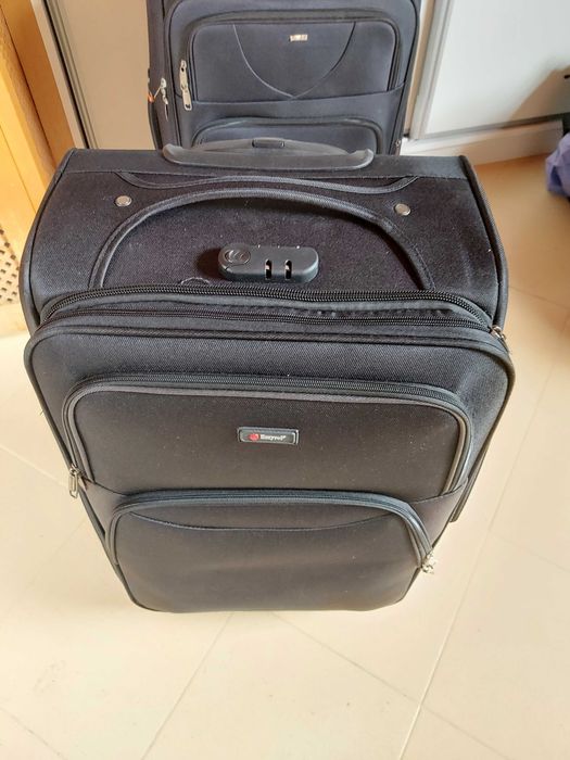 2 large black suitcases.