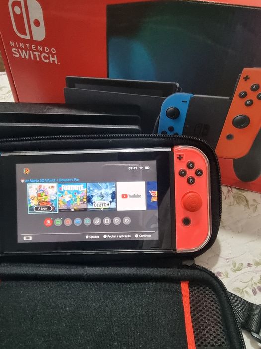 Nintendo Switch com caixa jogos e todos acessórios
