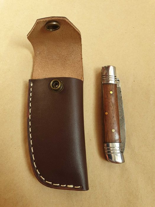 Складаний ніж у чохлі. Дамаск