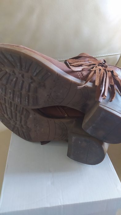 Botas de pele com franjas