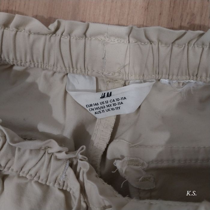 Modne spodnie H&M beżowe 146