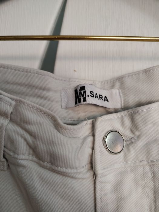 Spodnie białe  jeansowe  dżinsy z rozdarciami ,duże dziury wysoki stan