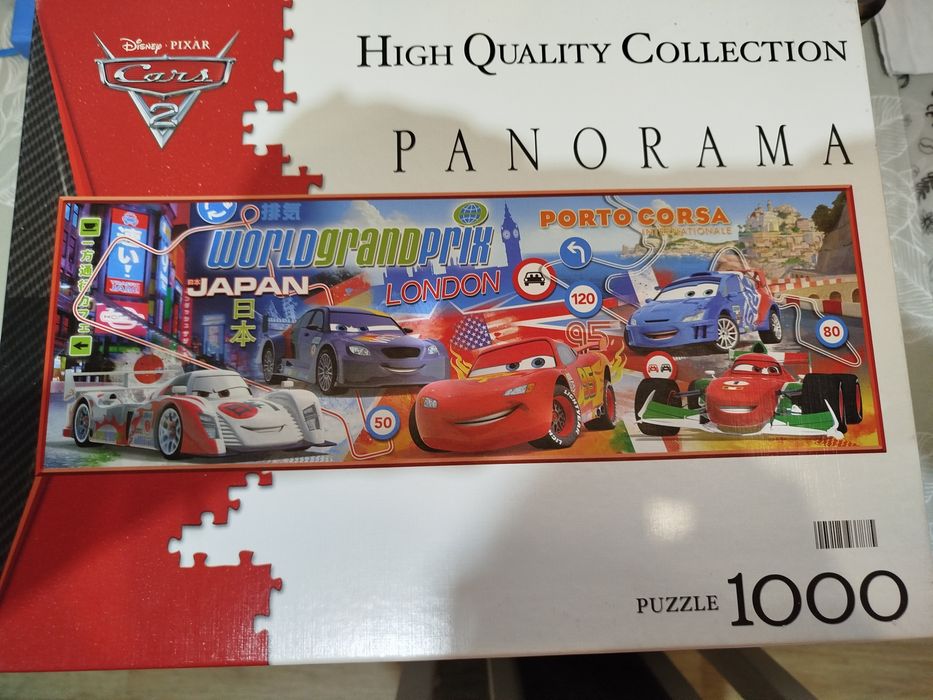 puzzle Clementoni Cars 2 (nr kat. 39196) składające się z 1000 elementów, przedstawiające motywy z filmu animowanego "Auta 2" z Zygzakiem McQueenem