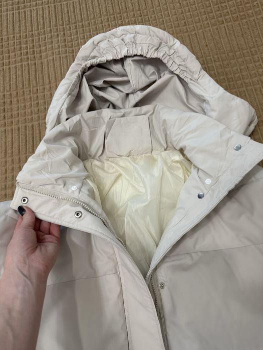 Пуховик в молочному кольорі