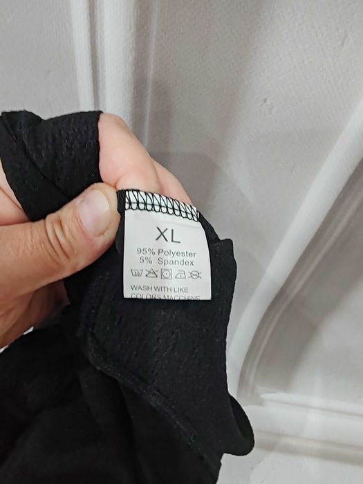 Czarny wygodny długi kombinzon rozmiar ok 44 poliester/spandex