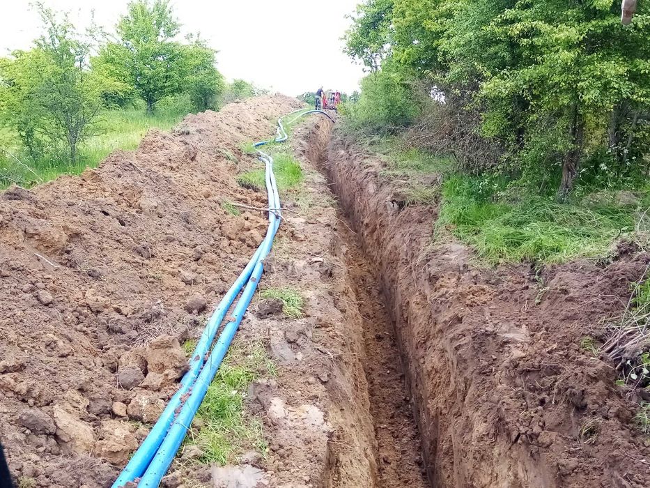 Koparko-ładowarka usługi kompletne prace i koparką linową stawy rowy.
