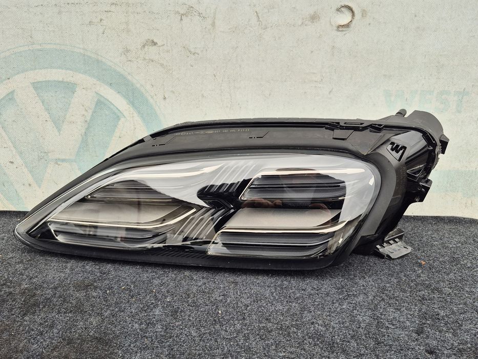 Фара левая Macan 95c макан 95с ліва передня 95c941009f